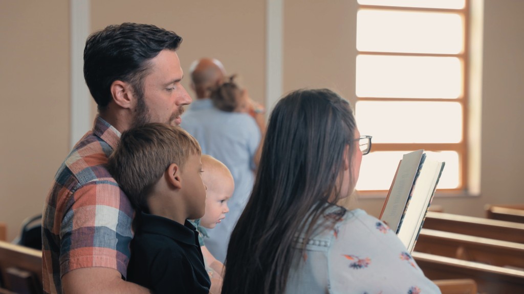 Young children sitting attentively in the pew during the service
